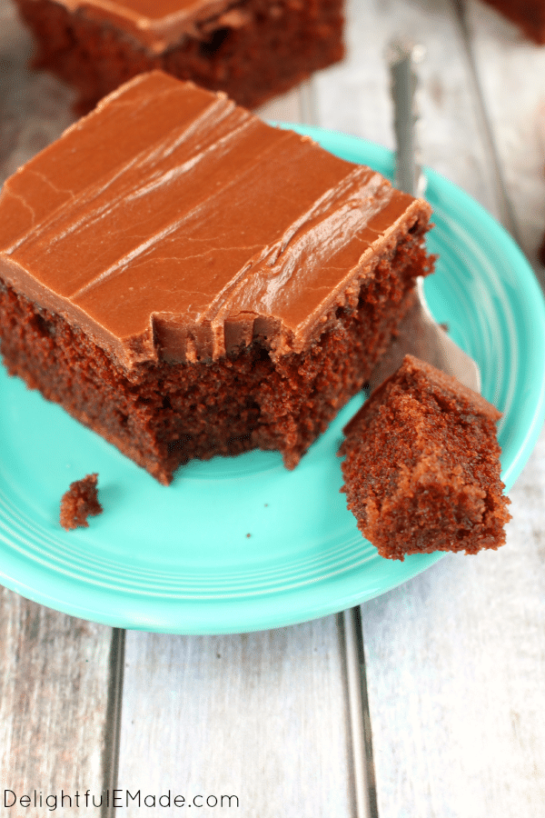 Super moist, chocolaty and completely delicious! This decadent chocolate sheet cake is topped with a luscious chocolate icing making it my all-time favorite chocolate cake! Once slice won't be enough!