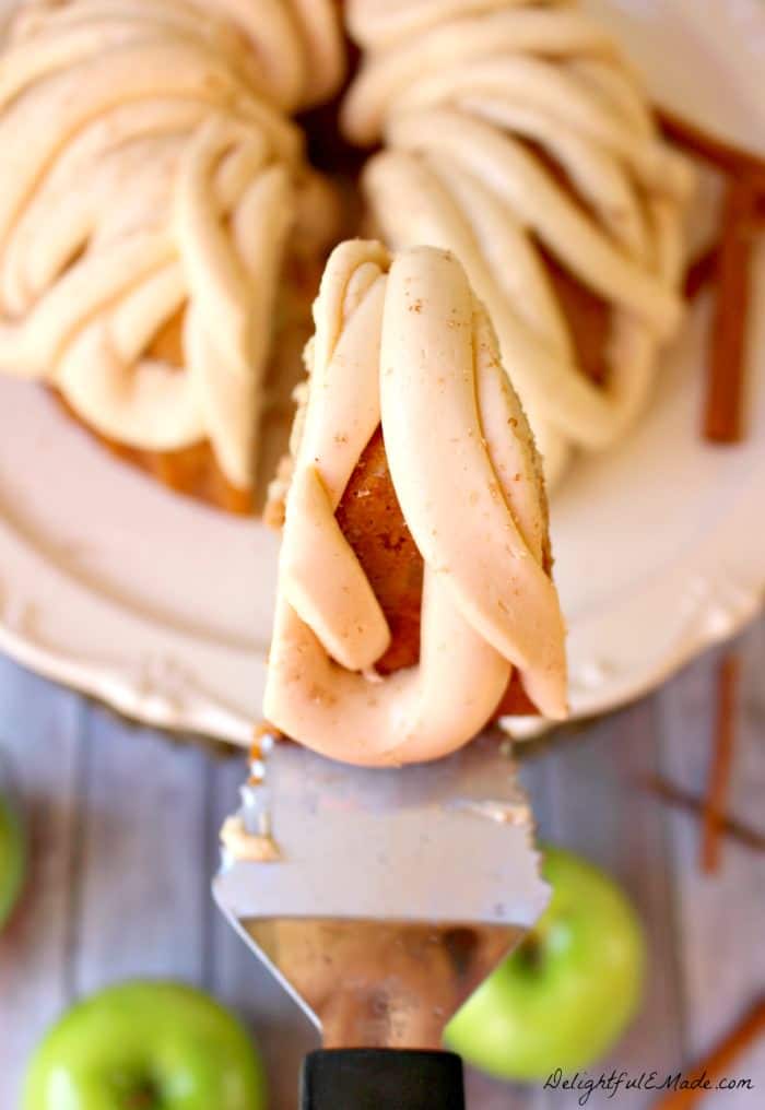 This amazing Apple Cider Cake recipe, topped with Caramel Cream Cheese Frosting is the perfect fall dessert! Made in a bundt pan, this fantastic apple cake will be a showstopper for any occasion!