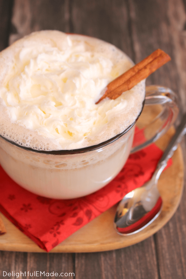 The ultimate hot buttered rum recipe for a cold night! This creamy, hot cocktail is made with spiced rum, cinnamon and ice cream to make it wonderfully decadent and delicious. This Hot Buttered Rum goes perfectly with fuzzy slippers, fireplaces and your favorite Christmas movie!