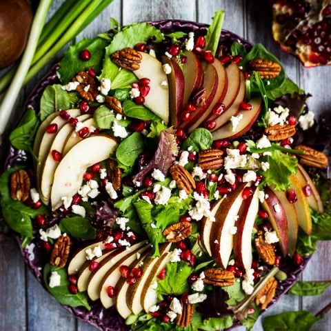 Looking for an amazing pear salad recipe? My Harvest Salad with Pears and Pomegranates is fantastic! Beautiful enough for a Thanksgiving or Christmas side dish and simple enough to make for weekday lunch paired with chicken or turkey!