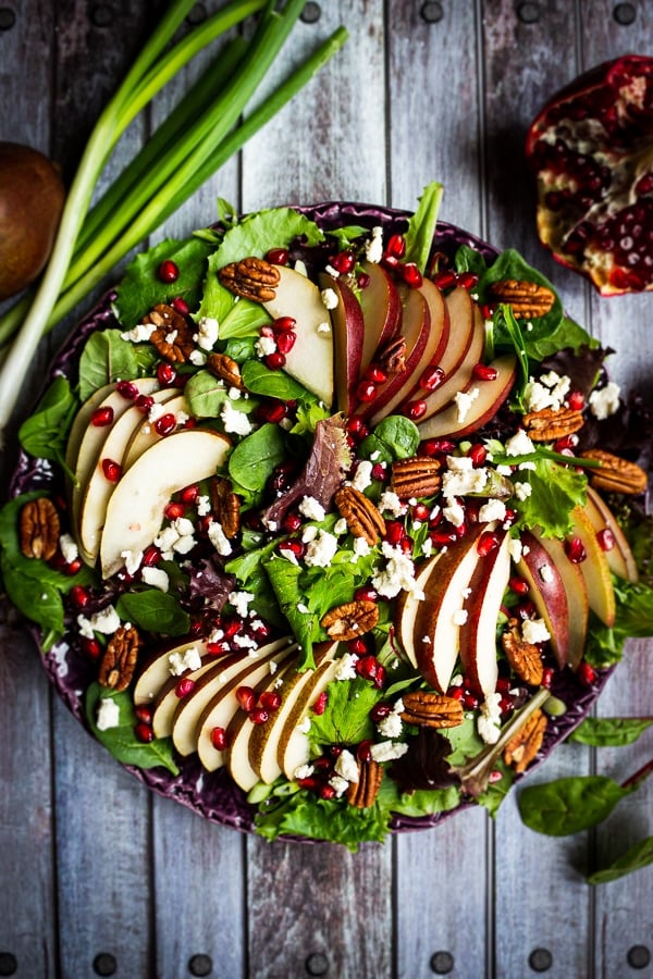 Looking for an amazing pear salad recipe? My Harvest Salad with Pears and Pomegranates is fantastic! Beautiful enough for a Thanksgiving or Christmas side dish and simple enough to make for weekday lunch paired with chicken or turkey!