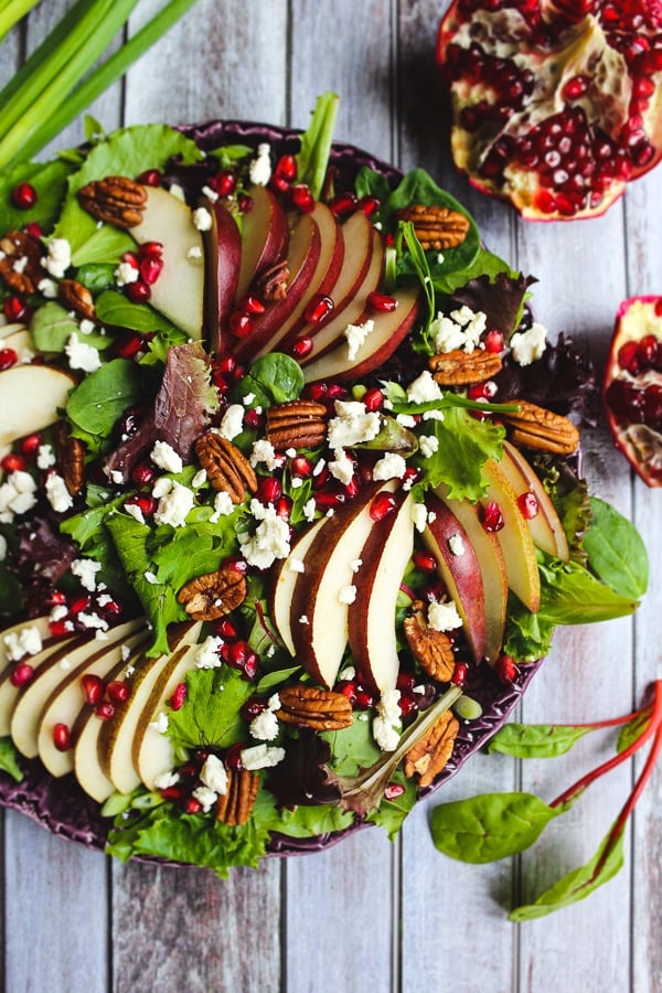Looking for an amazing pear salad recipe? My Harvest Salad with Pears and Pomegranates is fantastic! Beautiful enough for a Thanksgiving or Christmas side dish and simple enough to make for weekday lunch paired with chicken or turkey!