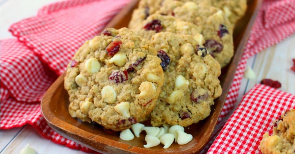 White chocolate cranberry oatmeal cookies garnished with white chocolate chips.