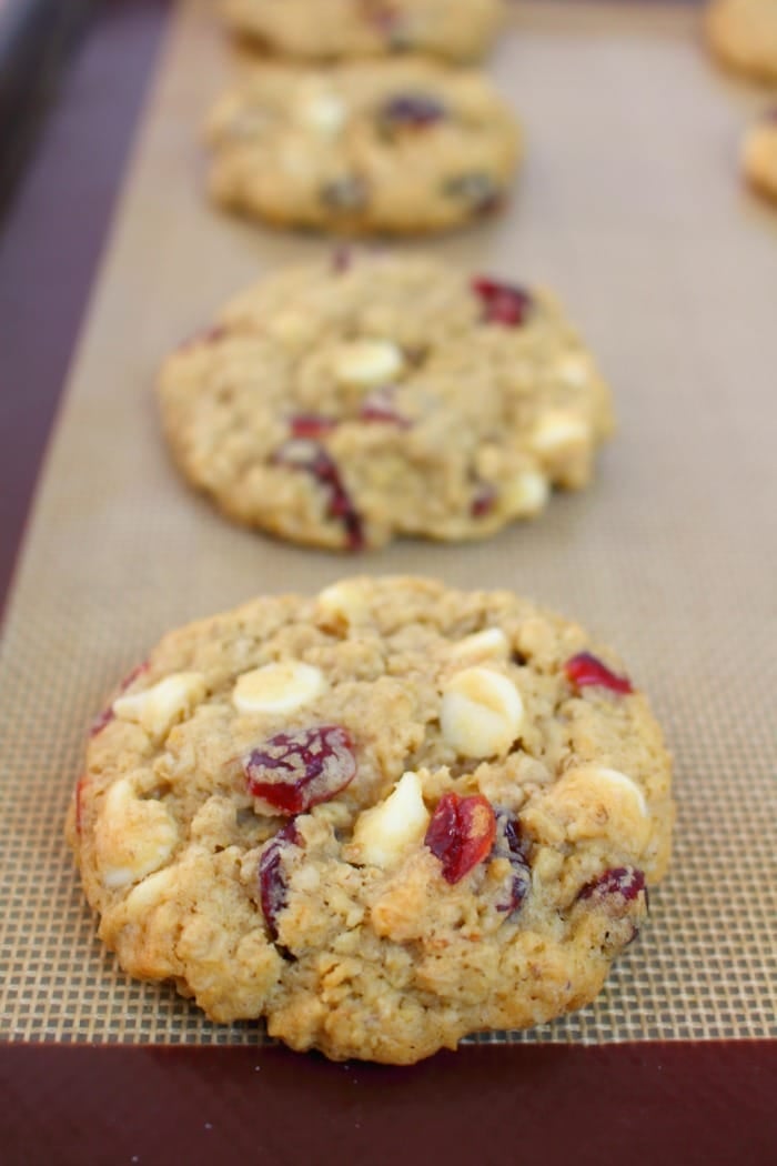 White Chocolate cranberry oatmeal cookies on a baking sheet.