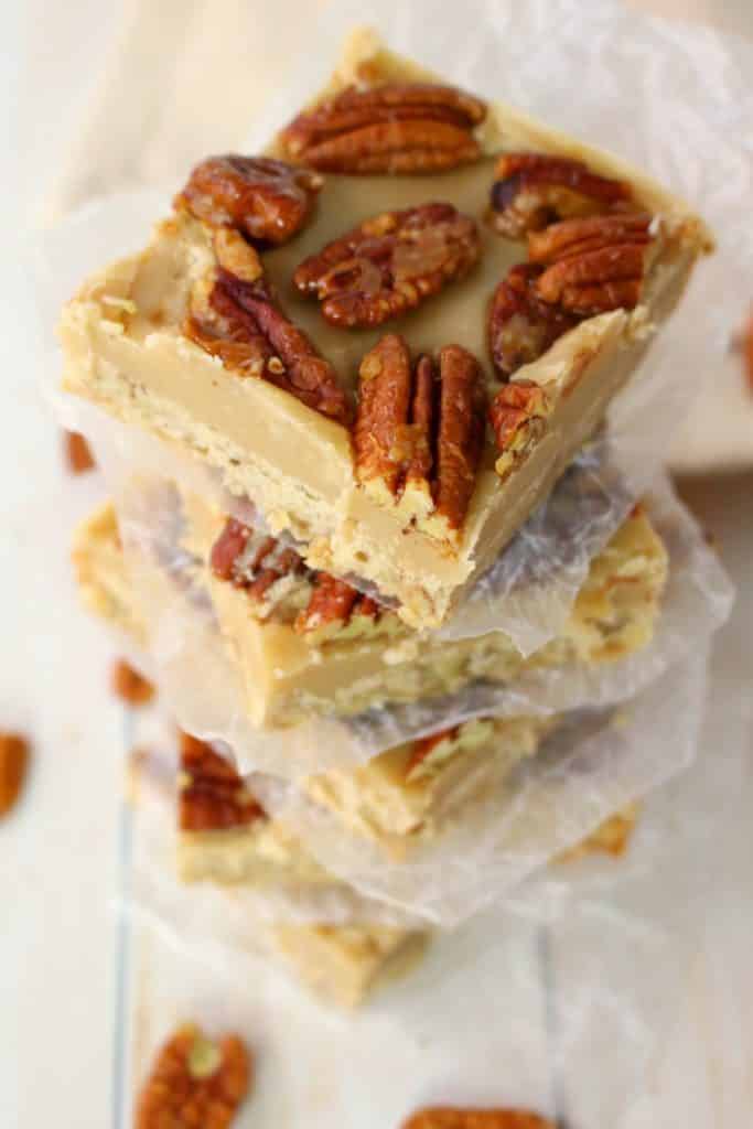 Cross between pecan pie and pecan sandies, these buttery, delicious Pecan Praline Bars are perfect any time you're in the mood for something sweet! An amazing pecan shortbread crust, a delicious caramel filling and topped with brown sugar toasted pecans, these bars are incredible! The perfect addition to your holiday cookie trays!