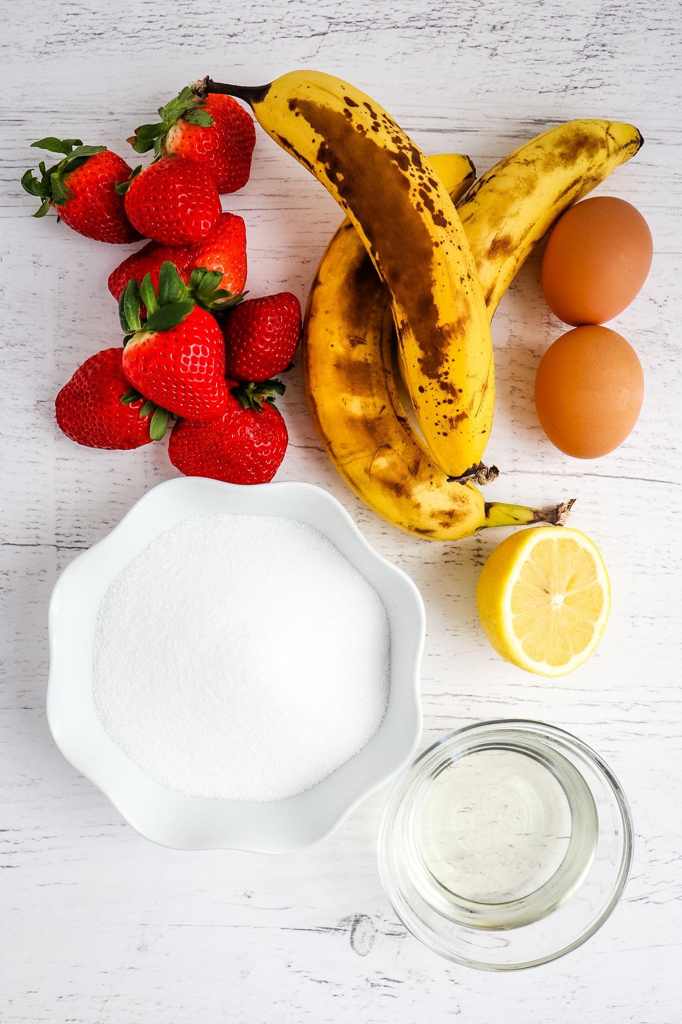 Wet ingredients for strawberry banana bread.