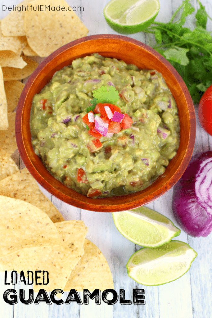 A must-have for any Mexican meal! This fresh, delicious chunky guacamole is loaded with fresh avocados, tomatoes, onions and the perfect spices.   You'll want to put this guacamole on everything!