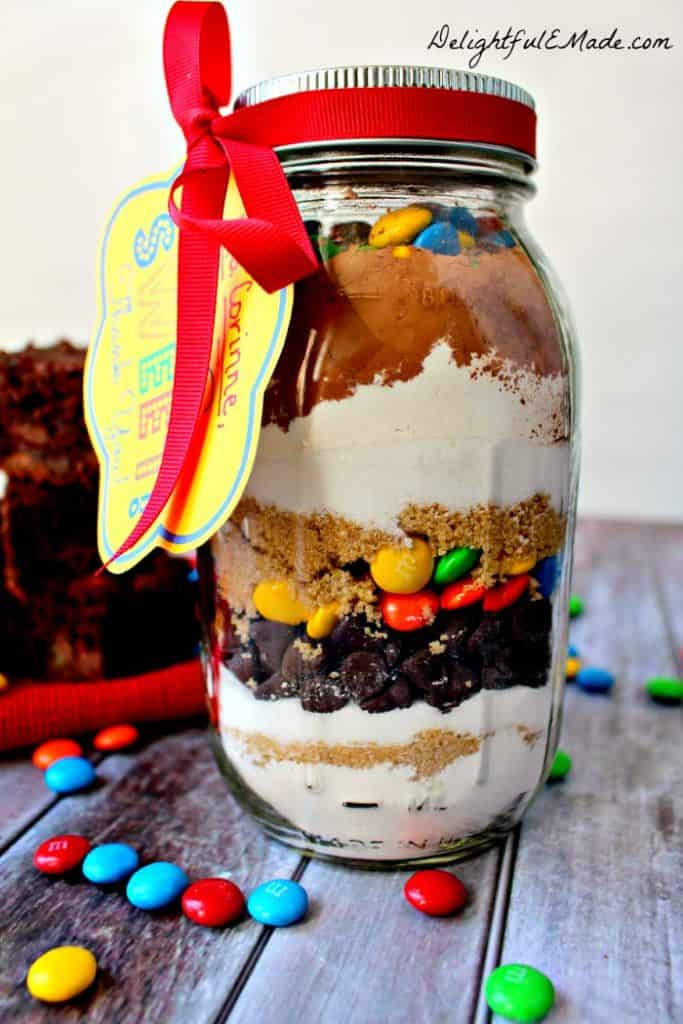 Everyone loves brownies!! Why not give it as a gift? This easy M&M Brownie mix in a jar is the perfect "Thank You" gift for anyone in your life. Makes a great teacher appreciation gift!