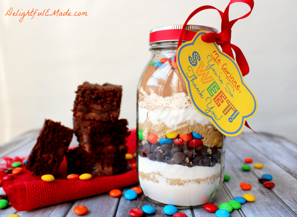 Everyone loves brownies!! Why not give it as a gift? This easy M&M Brownie mix in a jar is the perfect "Thank You" gift for anyone in your life. Makes a great teacher appreciation gift!