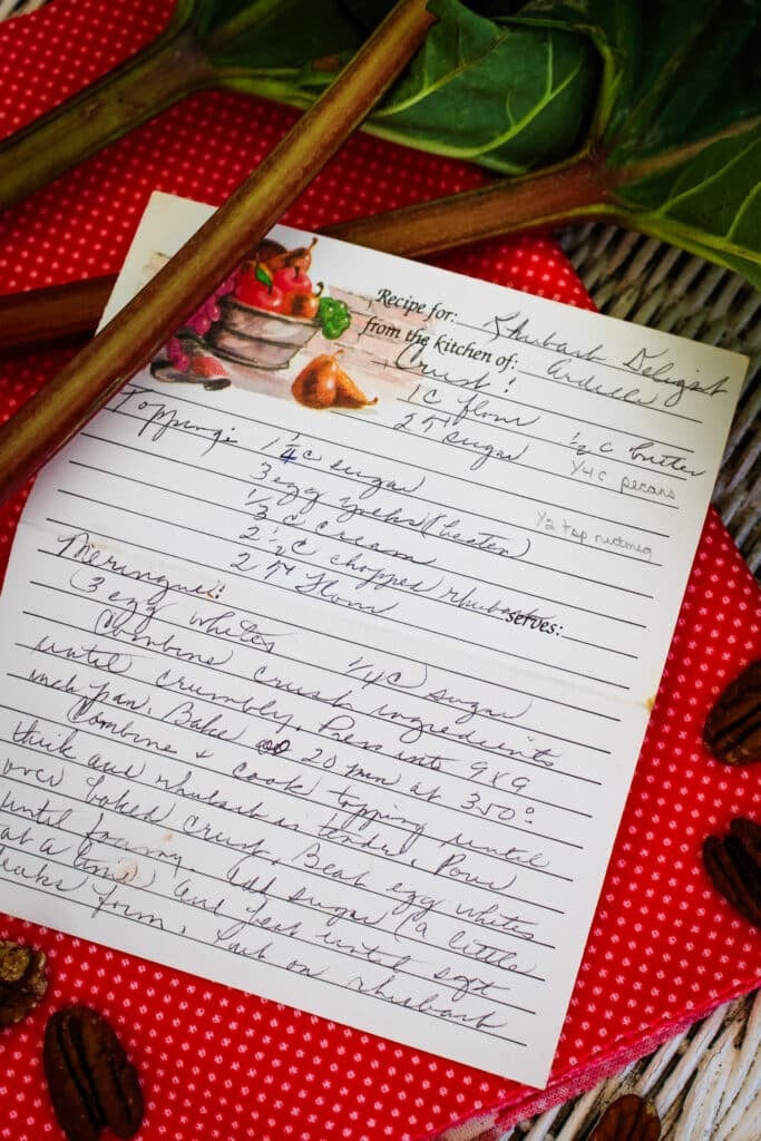 Ardelle's rhubarb delight recipe written in her handwriting on a recipe card.