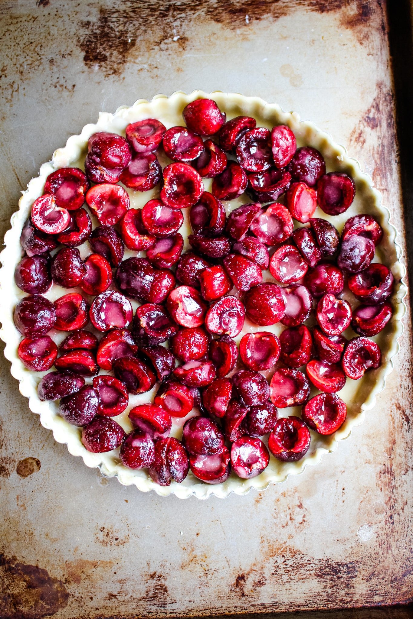 Coated cherries in tart crust for cherry tart recipe.