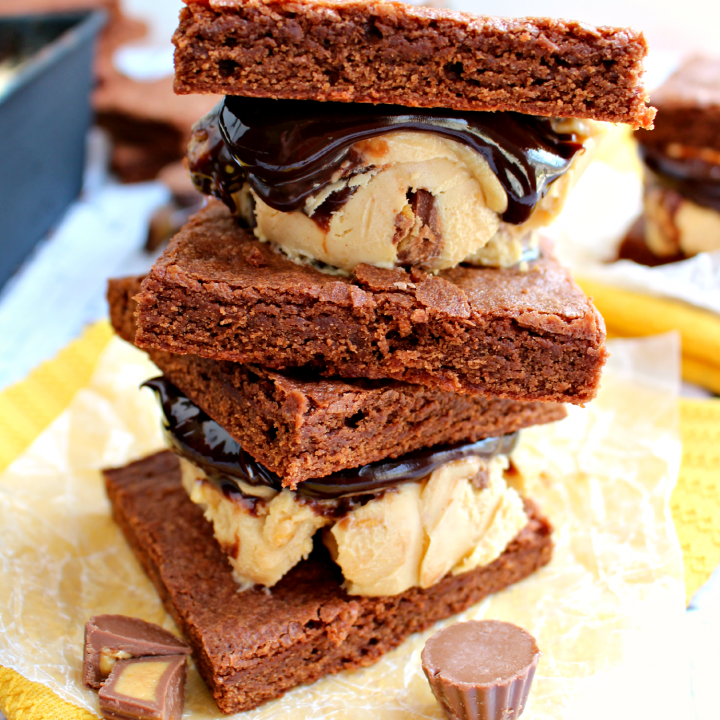 Chocolate and peanut butter lovers - you NEED these! Rich peanut butter fudge ice cream studded with Reese's Peanut Butter Cups and hot fudge sauce are sandwiched between two brownies making the most perfect summer dessert! INCREDIBLE!!