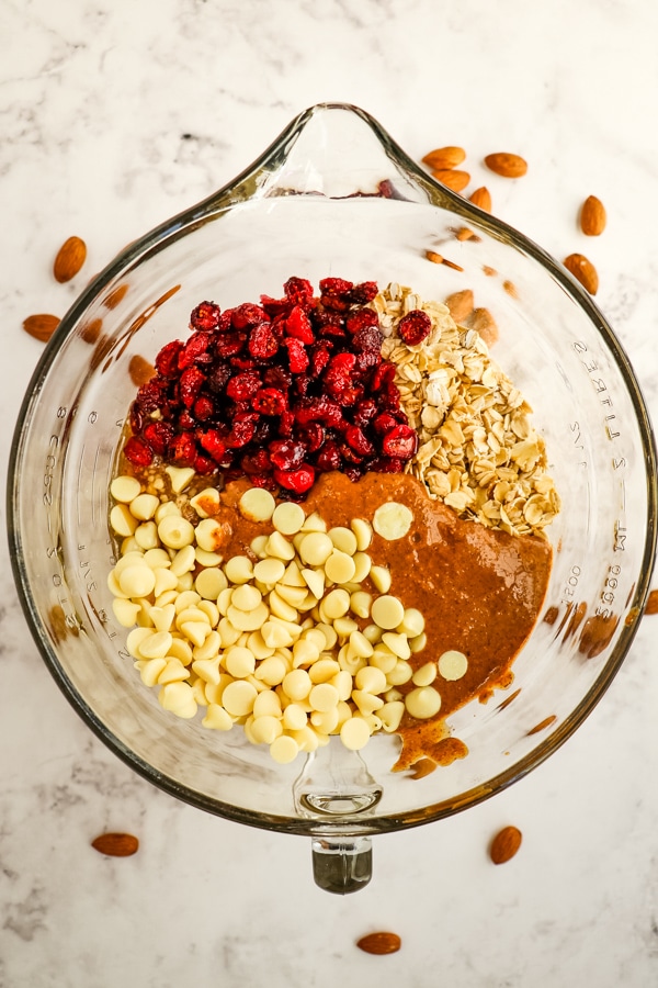 Ingredients for cranberry energy bites in bowl.