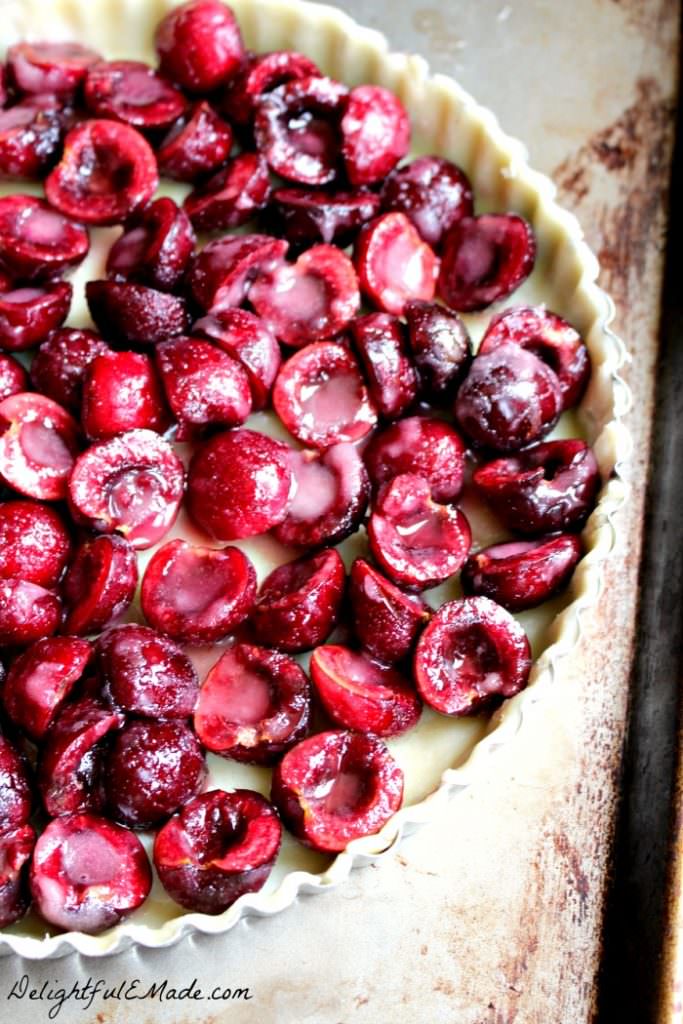 Even easier than Cherry Pie, this Cherry Almond Crumble Tart is fabulous! Loaded with fresh cherry flavor, this super-simple tart recipe, uses store-bought pie crust, along with fresh or frozen cherries. Makes an amazing Thanksgiving or Christmas dessert or just a simple weeknight treat!