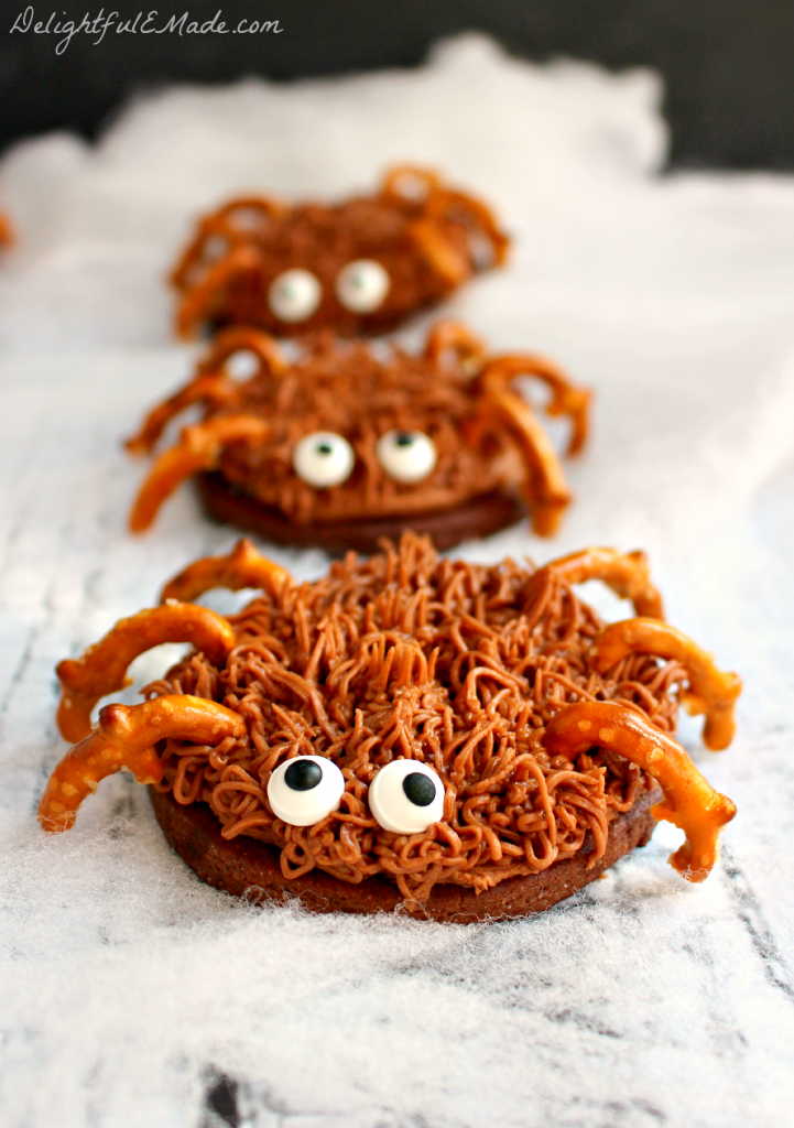 The perfect treat for your next Fall or Halloween Party!  Made with chocolate sugar cookies, pretzel legs and candy eyes, they're scary delicious!