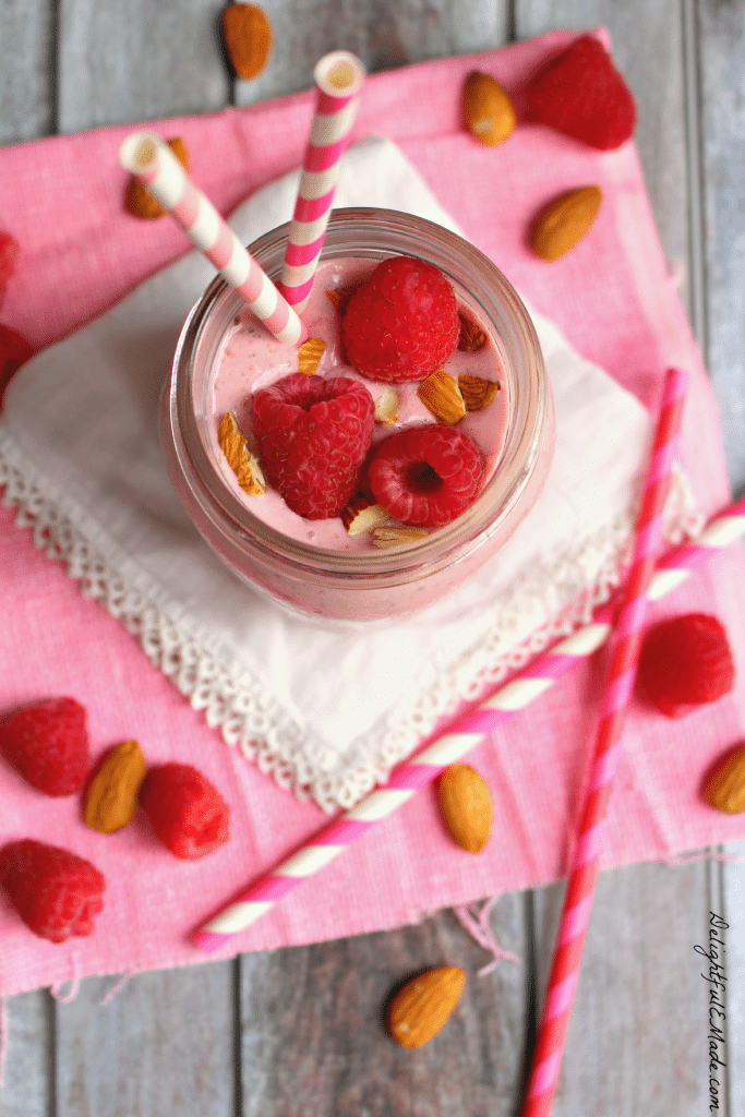 Meet your new favorite raspberry smoothie recipe! This delicious Raspberry Almond Chia Smoothie is not only pretty, but it's really good for you too!  Loaded with protein, antioxidants and packed with flavor this smoothie is the perfect way to start your day.