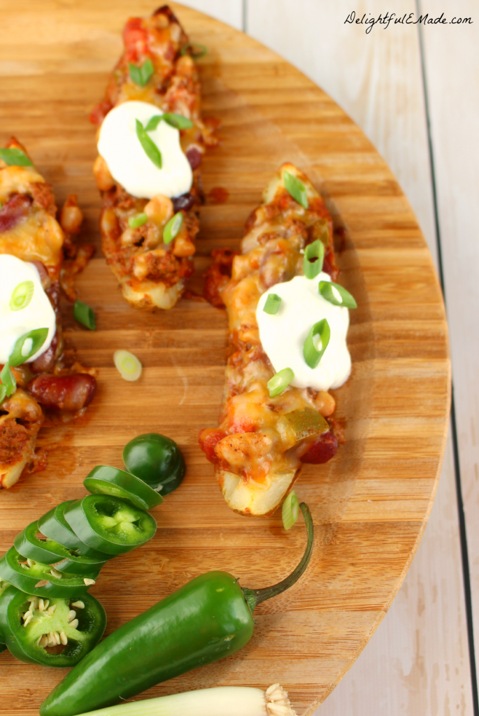 Not your ordinary appetizer! These Chili Cheese Potato Skins are loaded with thick, chunky chili, colby jack cheese, and sour cream and go great with an ice cold beer! 