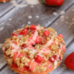 These Strawberry Coffee Cake Donuts are loaded with fresh, chopped strawberries, topped with coffee cake streusel and drizzled with glaze. Breakfast treats have never been more pretty or tasty as these!