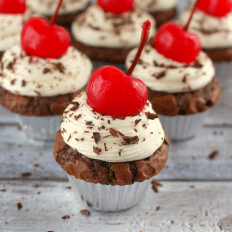 The classic cake turned into a brownie! Fudgy, delicious mini brownies topped with a luscious whipped cream cheese frosting, and a maraschino cherry.