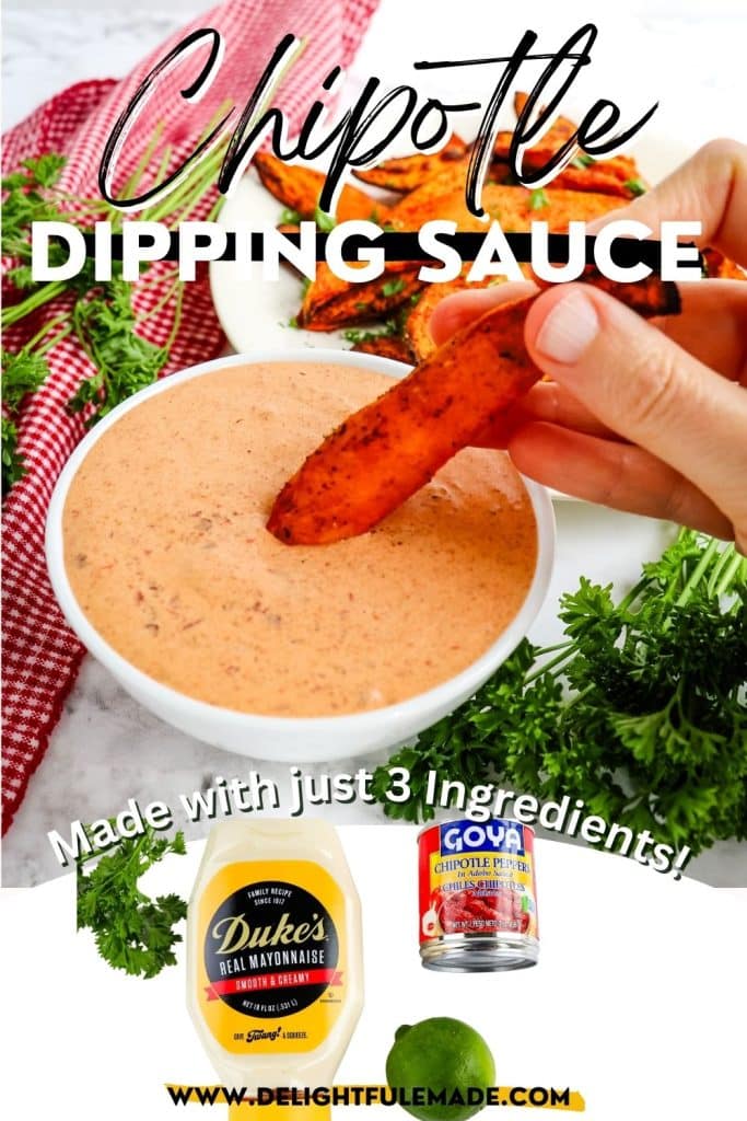 Sweet potato wedge being dipped in bowl of chipotle dipping sauce; bottom of photo includes mayo, can of chipotle peppers and a lime.