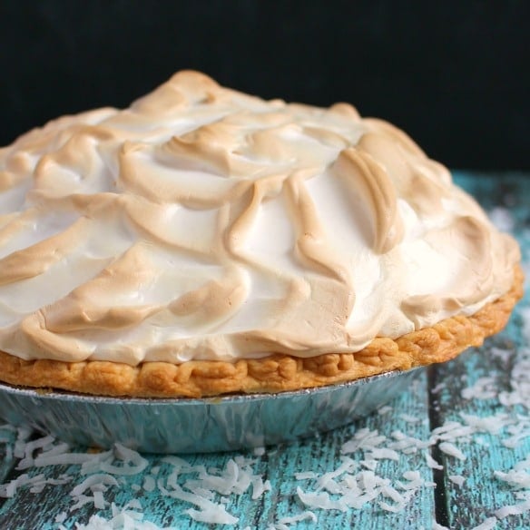 The coconut meringue pie of your dreams! This classic Coconut Cream Pie recipe is made with a gorgeous meringue and perfectly creamy coconut custard filling. This coconut cream pie with meringue is the ultimate dessert for any holiday meal or celebration!
