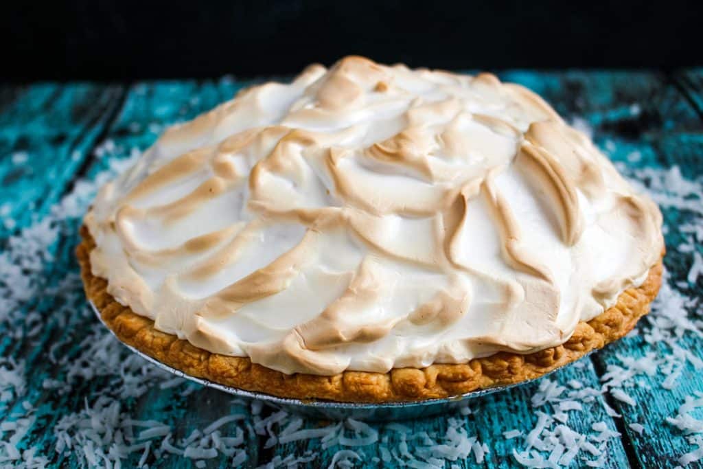 Coconut cream pie topped with a lightly browned meringue.