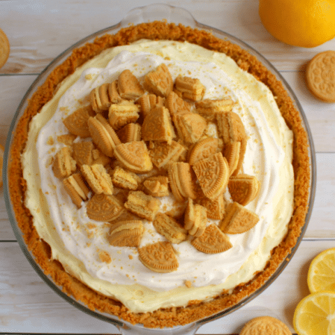 The best lemon pie you'll ever have! Made with a lemon OREO crust, filled with a creamy lemon filling and topped with more crunchy lemon OREO cookies, this dessert will be the highlight of your day!