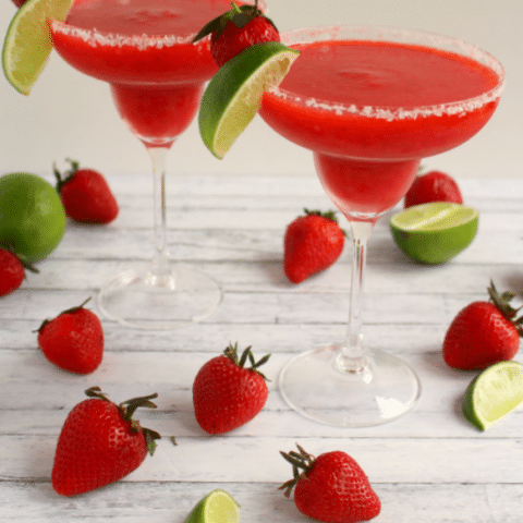Bust out the tequila, its time for a Margarita! Blended with frozen strawberries, lime juice, and rimmed with salt, these frozen margaritas are easy to make and wonderfully refreshing!