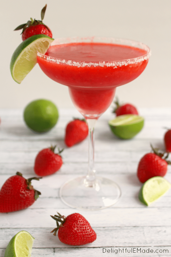 Bust out the tequila, its time for a Margarita! Blended with frozen strawberries, lime juice, and rimmed with salt, these frozen margaritas are easy to make, wonderfully refreshing and an all-time favorite cocktail!