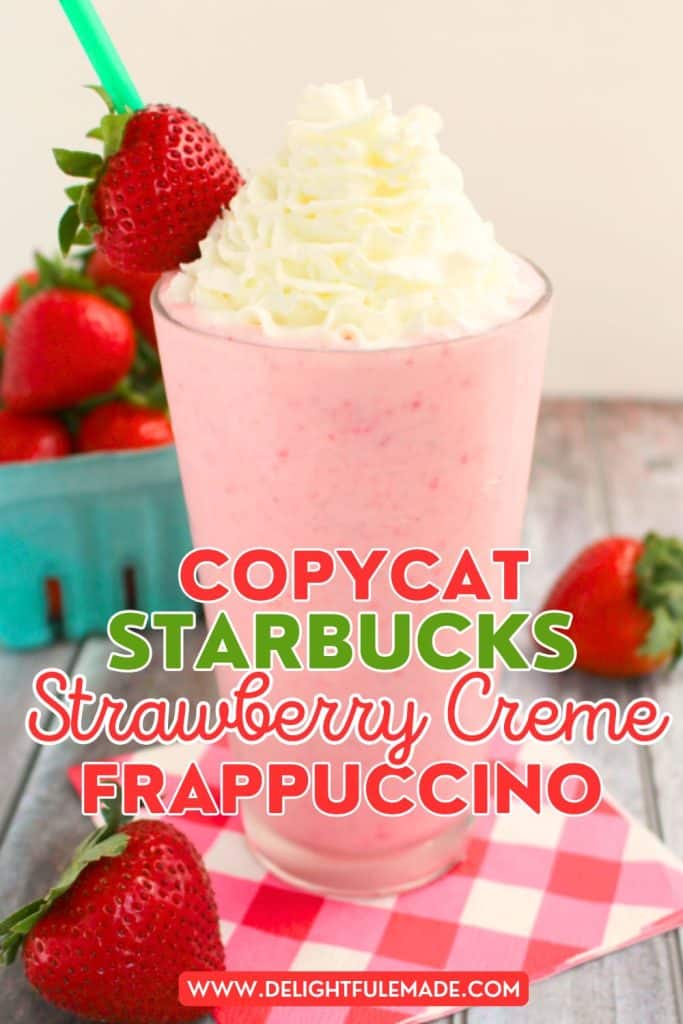 Copycat Starbucks strawberry frappuccino recipe in a clear glass topped with whipped cream and a strawberry.