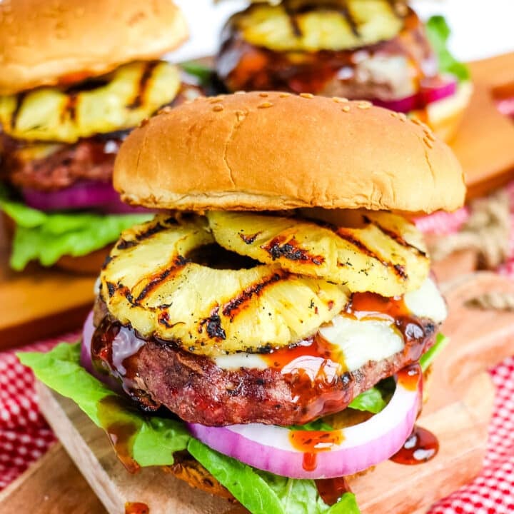 Pineapple burger topped with toasted sesame bun, grilled pineapple slices and teriyaki sauce.