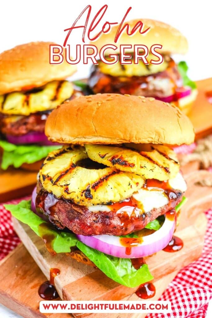 Aloha burger topped with grilled pineapple rings, and a toasted sesame bun.