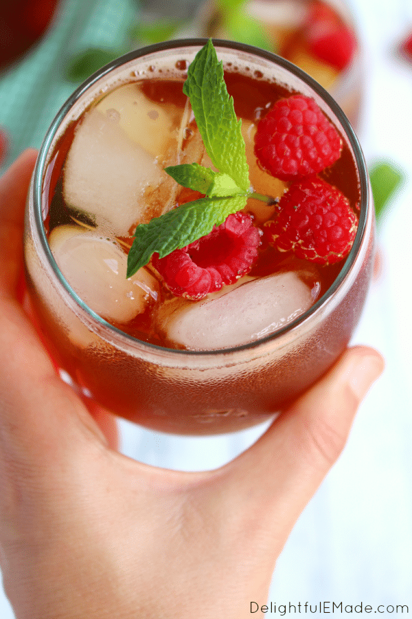 There's nothing better than a cold, refreshing glass of raspberry iced tea to quench your thirst! Made with fresh mint, raspberries and steeped to perfection, this easy iced tea recipe is the perfect drink for sipping on a hot summer day!
