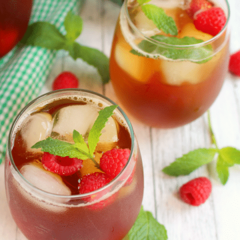 There's nothing better than a cold, refreshing glass of iced tea! Made with fresh mint, raspberries and steeped to perfection, this tea is the perfect drink for sipping on a hot summer day!