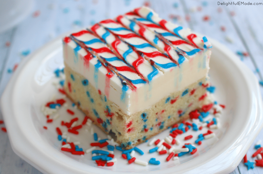 Lets celebrate America with these yummy, patriotic sugar cookie bars! The best sugar cookie recipe made into a bar, frosted with lots of delicious buttercream, and decorated with simple store-bought gel frosting, these cookie bars will be the hit of your July 4th picnic this summer!