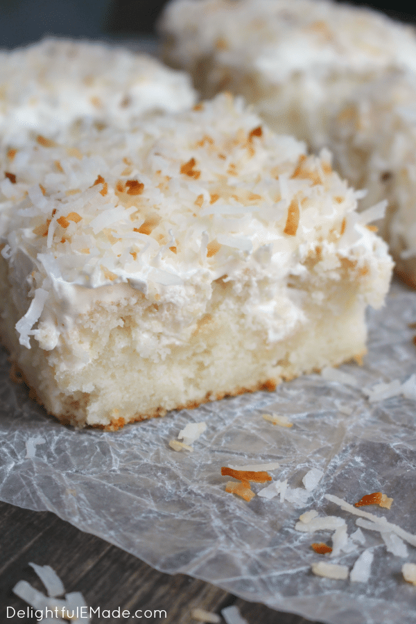 A dreamy, delicious coconut cake that will have you coming back for seconds! Creme of coconut is baked into a fluffy white cake making it super moist. The cake is then topped with coconut whipped cream and toasted coconut for the ultimate coconut treat!