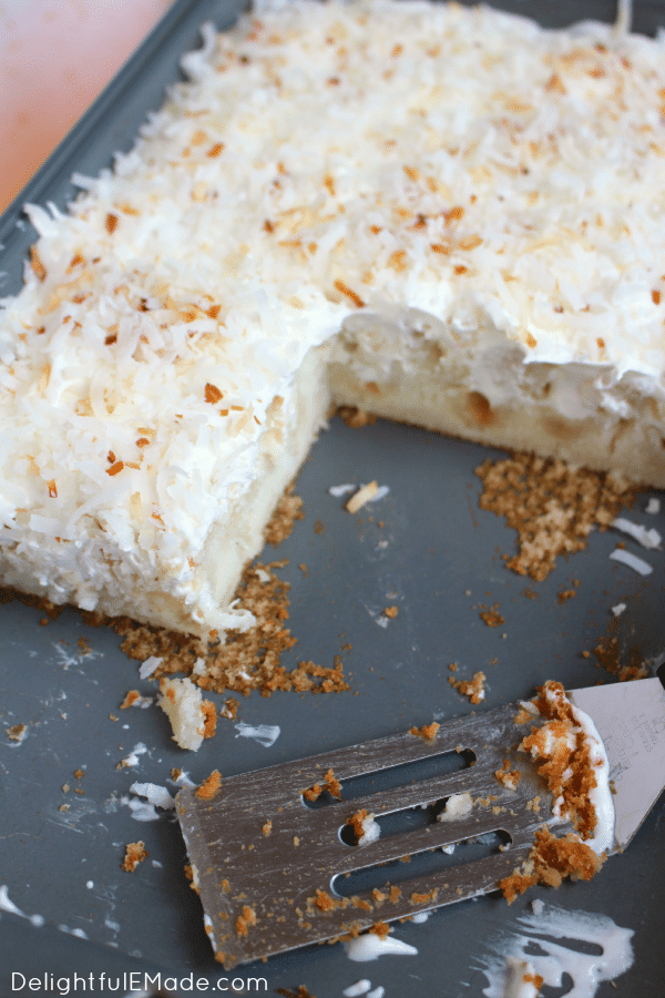 A dreamy, delicious coconut cake that will have you coming back for seconds! Creme of coconut is baked into a fluffy white cake making it super moist. The cake is then topped with coconut whipped cream and toasted coconut for the ultimate coconut treat!