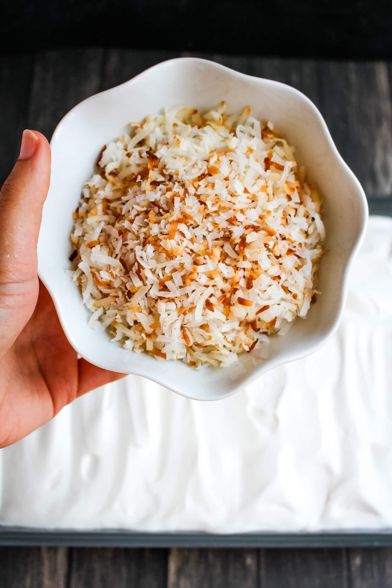 Toasted flake coconut in bowl.