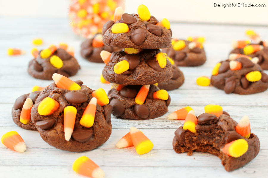 Soft, fudgy chocolate cookie dough paired with the fall classic candy corn come together for an incredibly moist, chewy cookie! Studded with big semi-sweet chocolate chips and topped with candy corn, these cookies will be a new favorite with everyone in your family! The perfect fall treat!