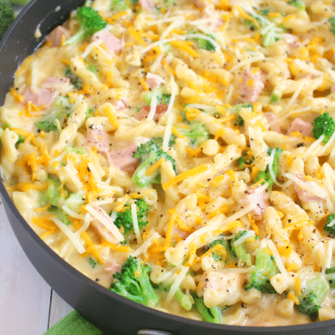 This one-skillet meal has everything you need for a fantastic dinner, including smokey, delicious ham, fresh broccoli, and pasta all in an amazing two cheese sauce! Best of all, this easy pasta dinner is done and on the table in under 30 minutes!