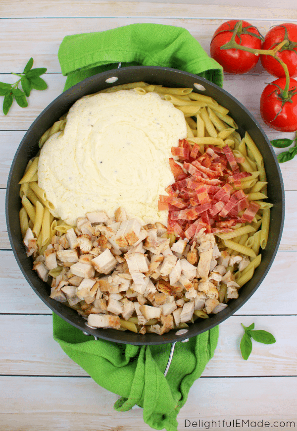 A quick, easy & delicious pasta dish everyone will love! Perfect as a fast, weeknight meal this Penne Chicken Alfredo with Bacon is made with Barilla Pronto Pasta and Tyson Grilled & Ready Chicken Strips, taking the extra prep work out of cooking, and giving you extra time with your family at the table!