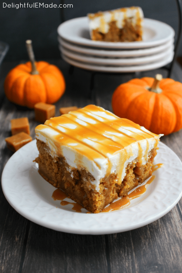 The ultimate fall dessert! A pumpkin spice cake is drizzled with caramel sauce, frosted with a decadent cream cheese frosting and topped with even more caramel sauce! You'll love every single morsel of this uber moist, delicious cake!