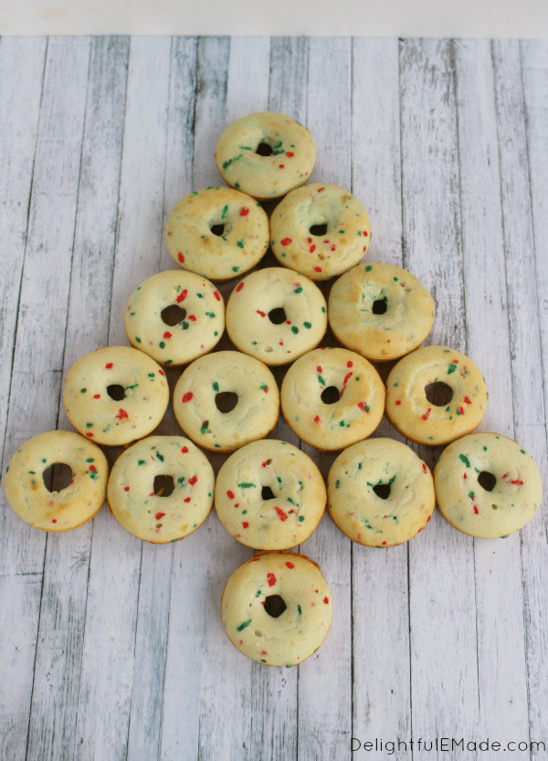 These Christmas Tree Donuts are a fun, morning treat perfect for the holidays! Adorned with Milk Chocolate and White Peppermint M&M's® , these festive baked cake donuts are fun to decorate with everyone in the family. The perfect treat to enjoy with hot chocolate!