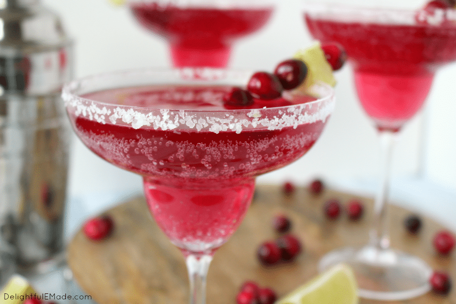 Cranberry and lime flavors come together with tequila for the most amazing holiday cocktail! Perfect for all of your Christmas parties and holiday gatherings, this easy, delicious margarita is perfect for enjoying under the mistletoe!