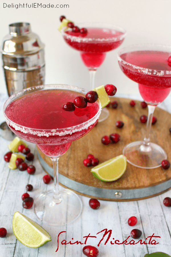 Cranberry and lime flavors come together with tequila for the most amazing holiday cocktail! Perfect for all of your Christmas parties and holiday gatherings, this easy, delicious margarita is perfect for enjoying under the mistletoe!