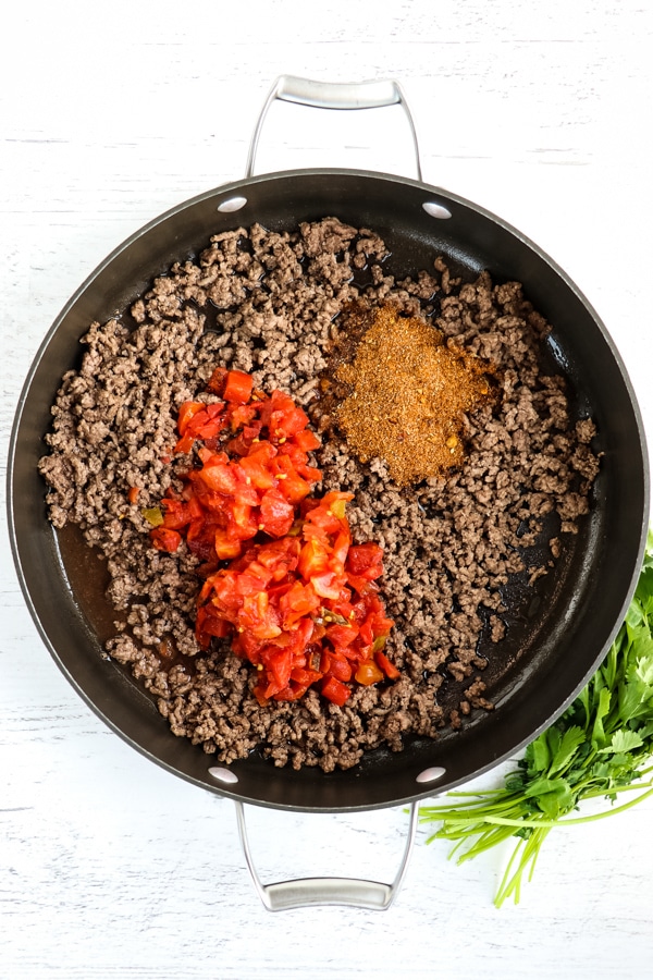 Browned ground beef with taco seasoning and rotel tomatoes.