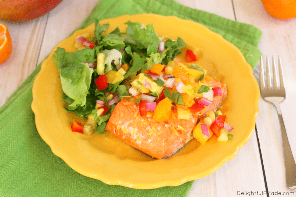 The most flavorful, delicious Salmon you'll ever have! This healthy, easy dinner comes together in minutes and is topped with my fresh, delicious Pineapple Mango Salsa! Perfect any day of the week!