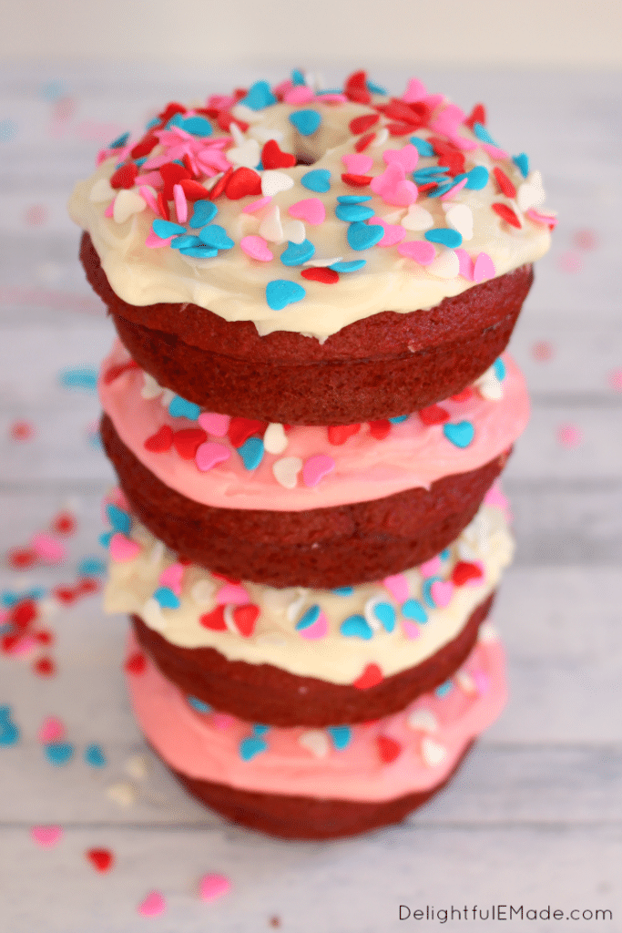 Perfect to treat your Valentine's, these Red Velvet Donuts with Cream Cheese Frosting are amazing! They make for fun classroom Valentine's treats, a great weekend breakfast for the family or even a great workplace snack!