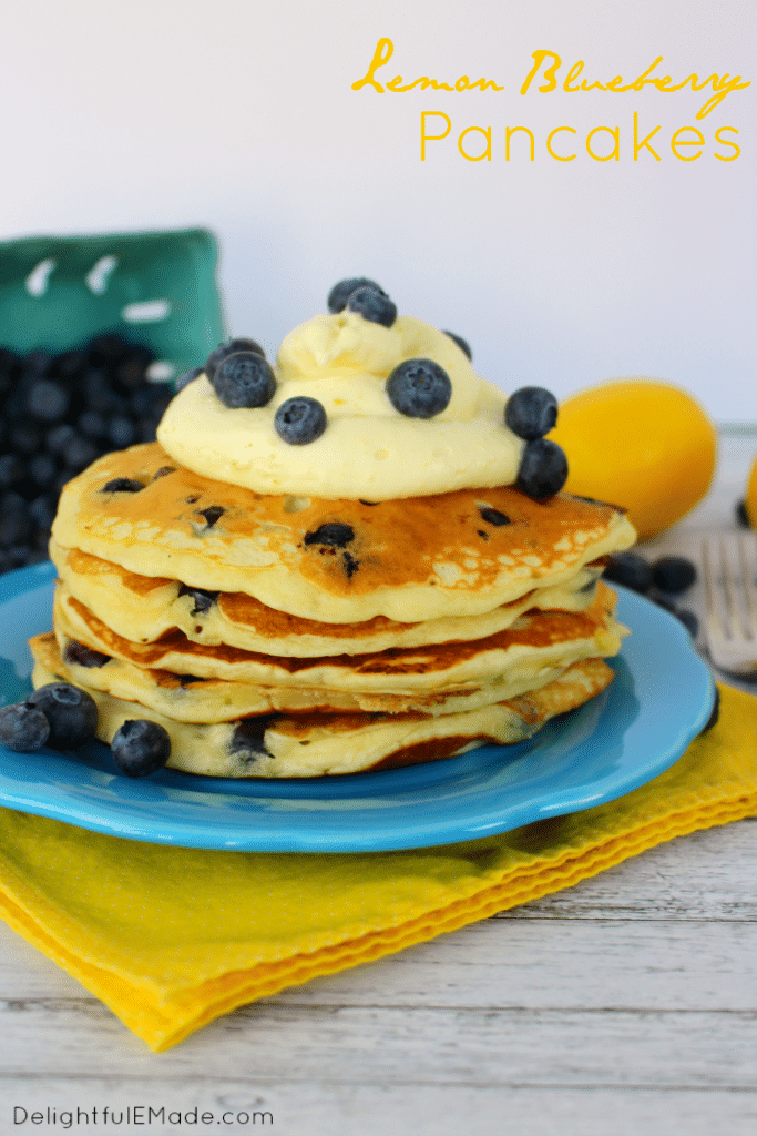 The fresh, delicious flavors of lemon and blueberry come together in these fluffy Lemon Blueberry Pancakes.  Topped with a delicious lemon cream cheese whipped topping, and fresh blueberries, these make for an amazing breakfast or brunch!