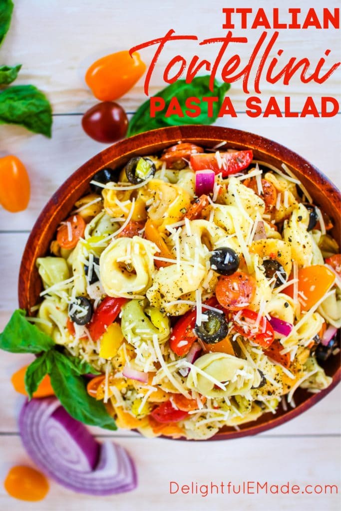 This EASY tortellini salad recipe is perfect for any pot-luck, picnic, cookout or backyard barbecue!  This delicious tortellini pasta salad is loaded with all of your Italian favorites, like salami, tomatoes, olives, banana peppers and more!  Topped with Italian dressing and shredded Parmesan cheese, this Italian pasta salad is amazing!
